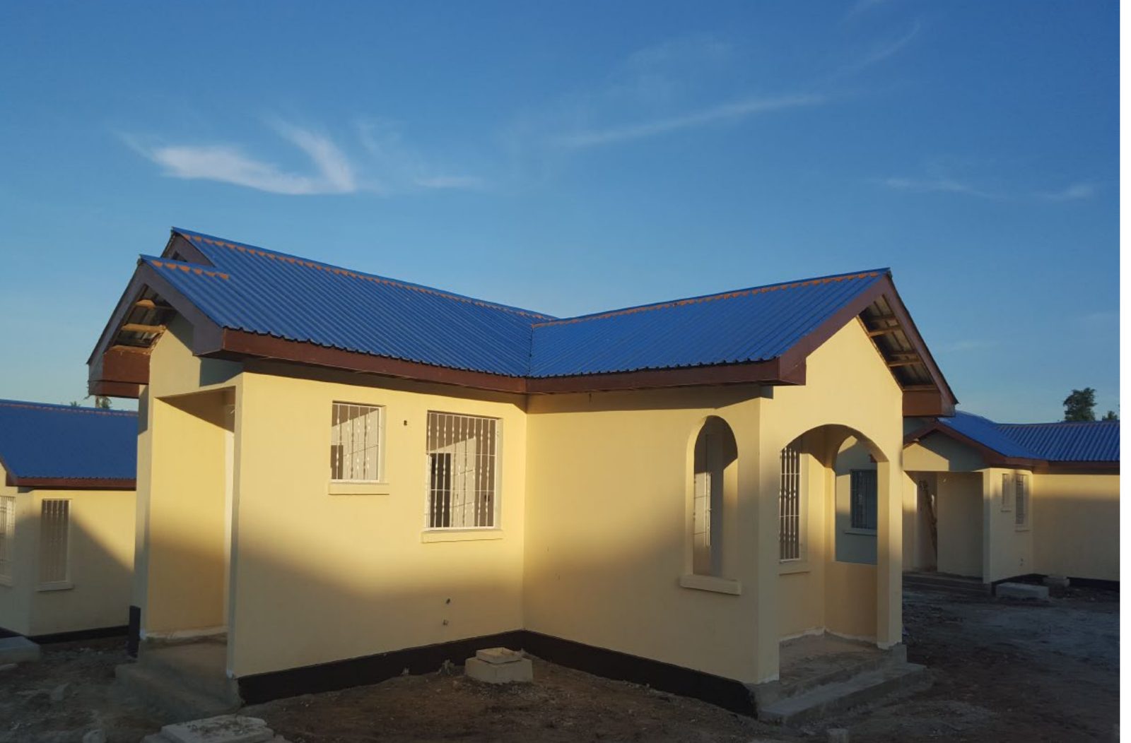 Finished home with blue Dragon roofing at the Buswelu project, Mwanza