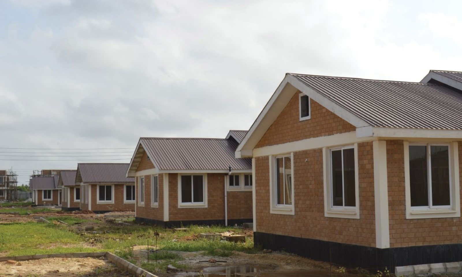 Close view of a finished house at the Mwongozo project