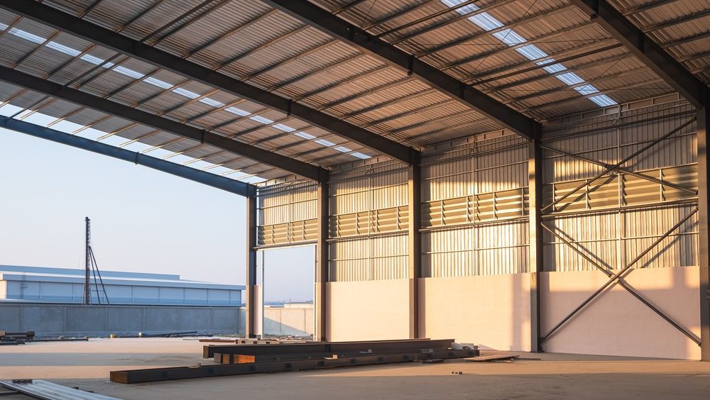 Inside a new steel warehouse with a sheet-metal roof and wall cladding